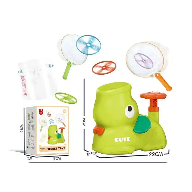 Green toy with frisbee-shaped parts and packaging on a white background