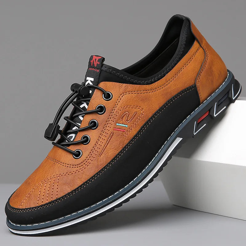 Brown leather shoe with black accents on a gray background