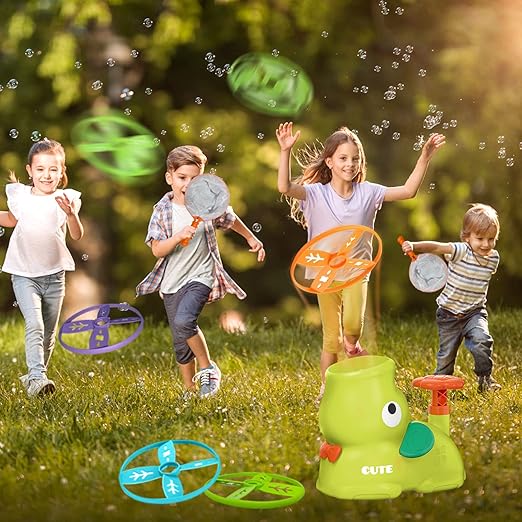 Children playing with bubble toys in a grassy outdoor setting