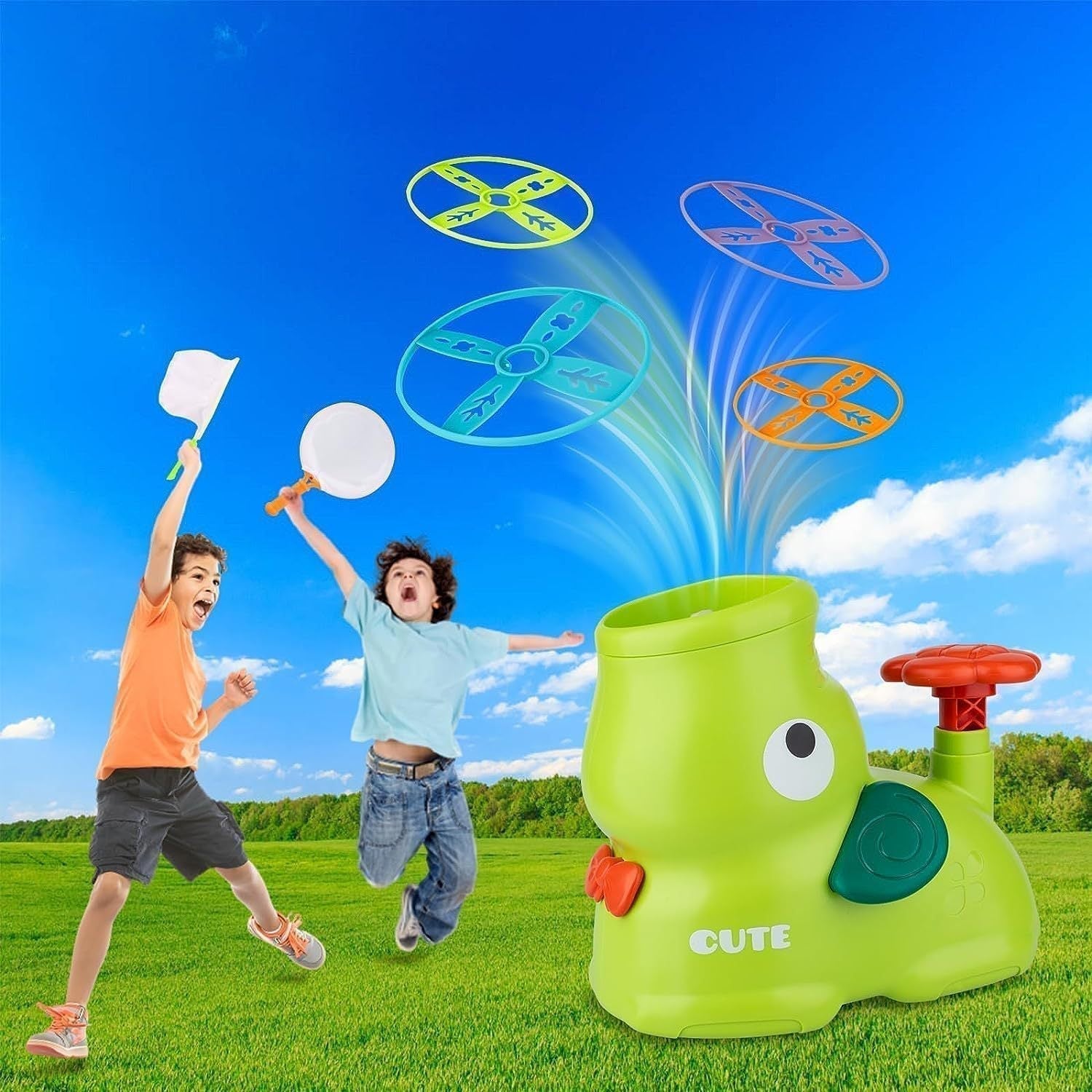 Children playing with a green toy that launches colorful discs against a blue sky.
