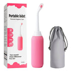 Pink portable bidet with packaging and gray carrying pouch on a white background