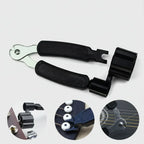 Guitar accessories including a black foot pedal and metal components on a white background.