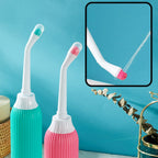 Two dental water flossers, one green and one pink, with a close-up of the nozzle on a blue background.