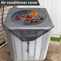 Air conditioner cover with leaves on top, placed on an outdoor air conditioning unit.