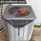 Air conditioner cover with leaves on top, placed on an outdoor air conditioning unit.