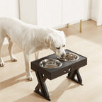 White dog eating from a raised pet feeder with two bowls on a light wooden floor.