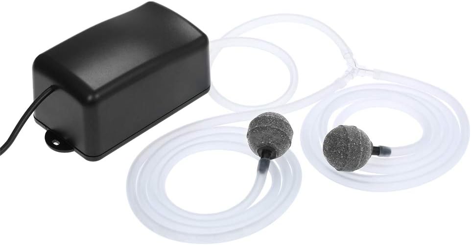 Black electronic device with two gray nozzles and white tubing on a white background