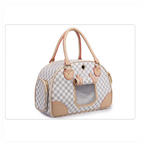 Checkered pet carrier with beige accents on a white background