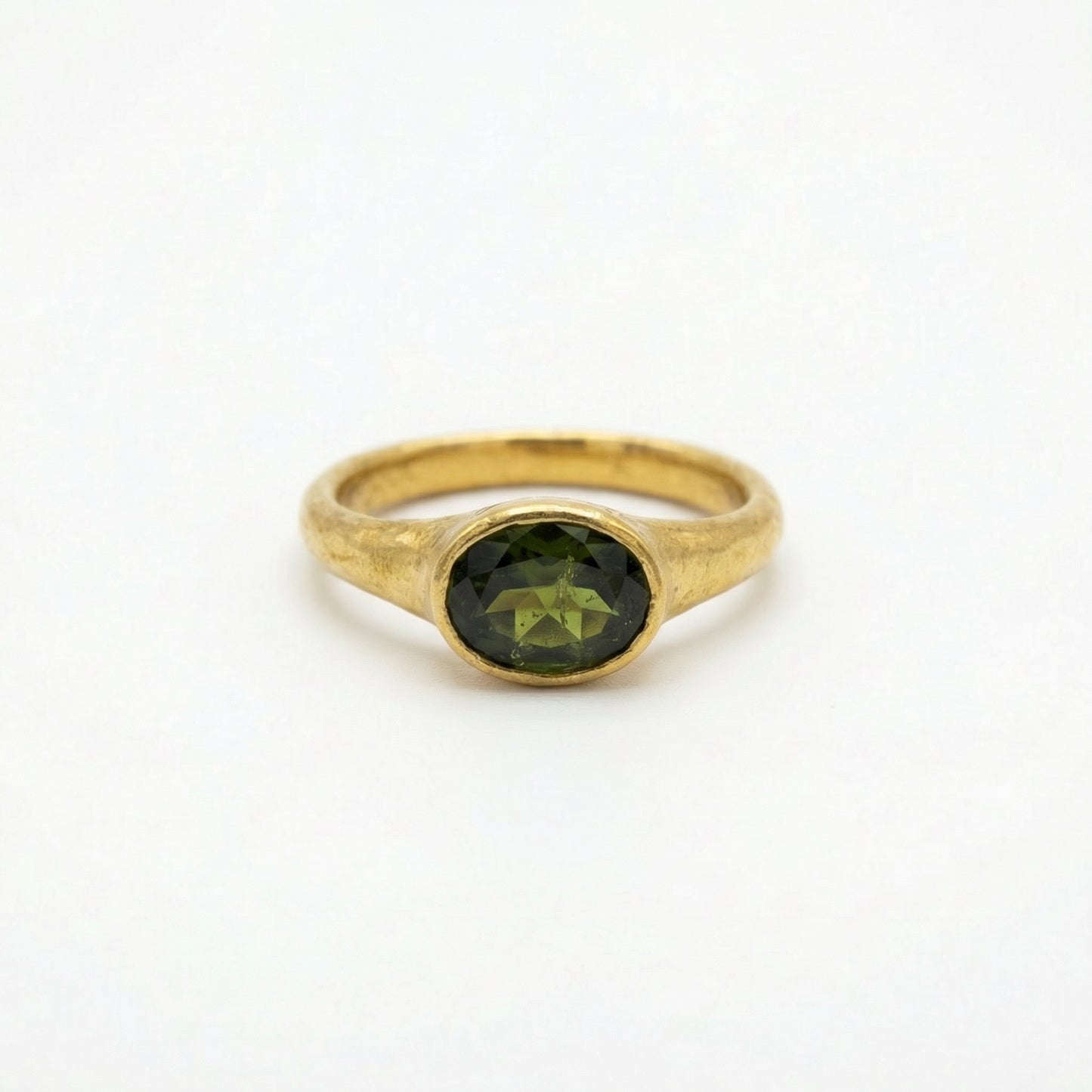 Gold 22ct handcrafted ring with peridot gem from Ram Rijal.