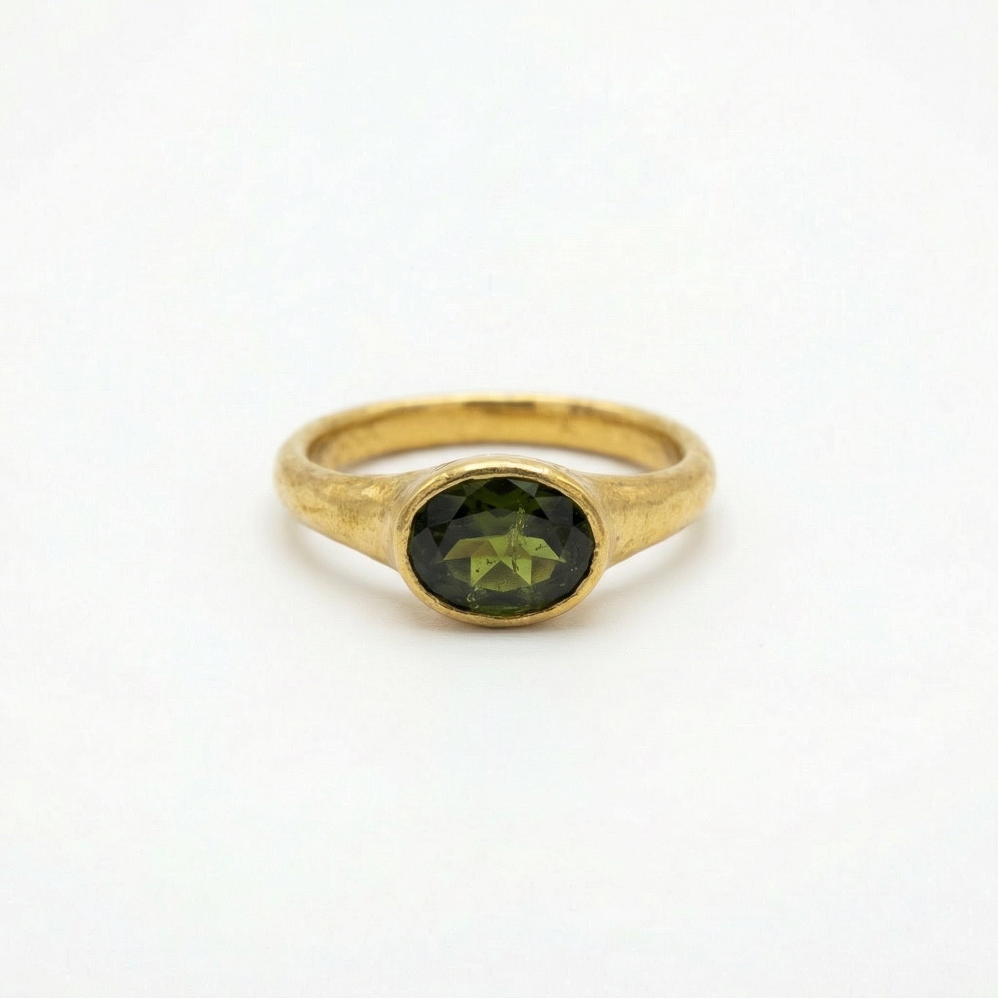 Gold 22ct handcrafted ring with peridot gem from Ram Rijal.