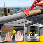 Rust paint being applied to a metal surface with a cityscape in the background.