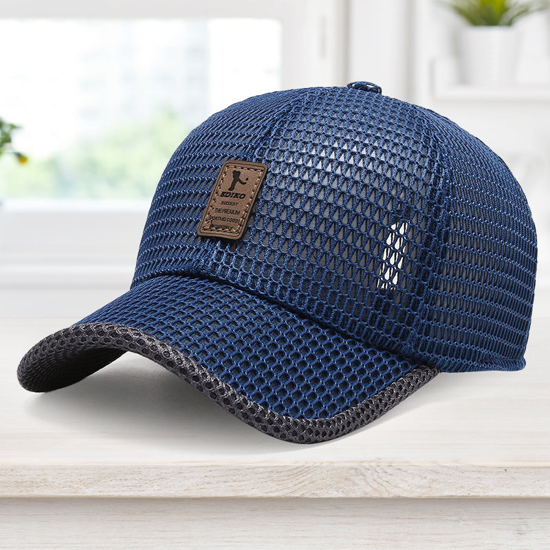 Blue mesh cap with a brown leather patch on a white surface