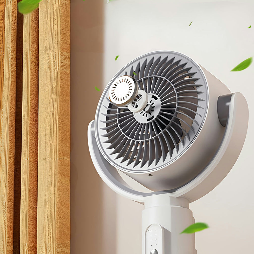 Portable fan with a white base and gray top against a neutral background