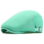 Mint green mesh cap on a white background