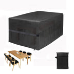 Black outdoor furniture cover with a wooden table and chairs on a white background