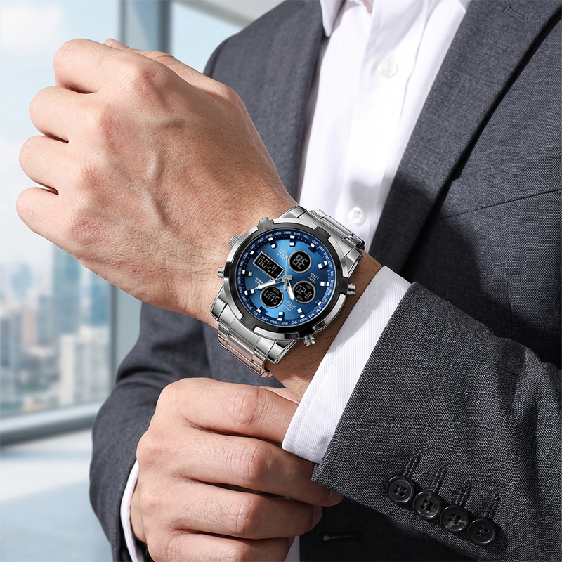 Man wearing a silver wristwatch with a blue face in an office setting