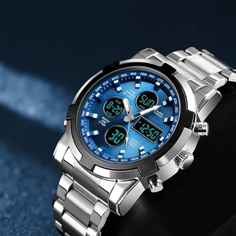 Silver wristwatch with a blue digital face on a dark background