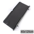Black metal screen with mounting brackets on a white background, size 55x125cm.