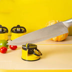 Knife sharpener with a knife on a yellow background