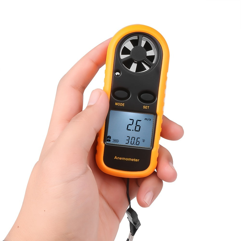 Anemometer held in a hand with a white background