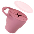 Pink silicone lid on a white background