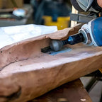 Woodworking process with a router on a wooden surface