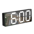 Digital clock with large white LED numbers on a black frame