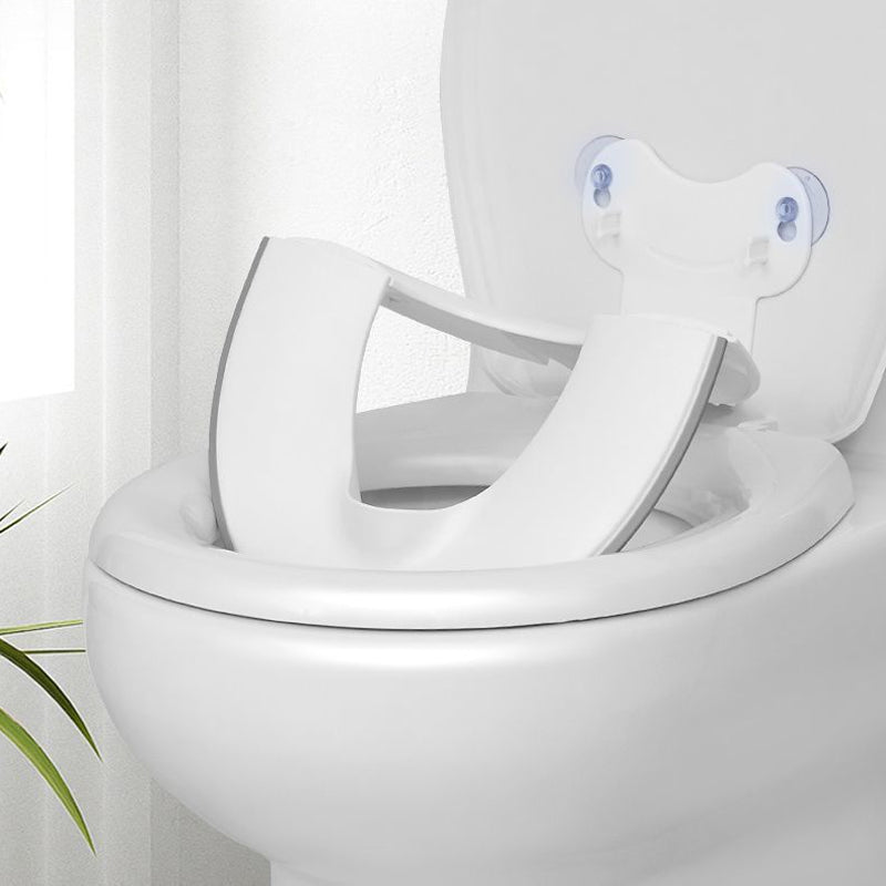 White toilet seat with a cover on a white background