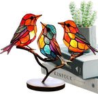 Colorful stained glass bird lamps on a branch with a white background