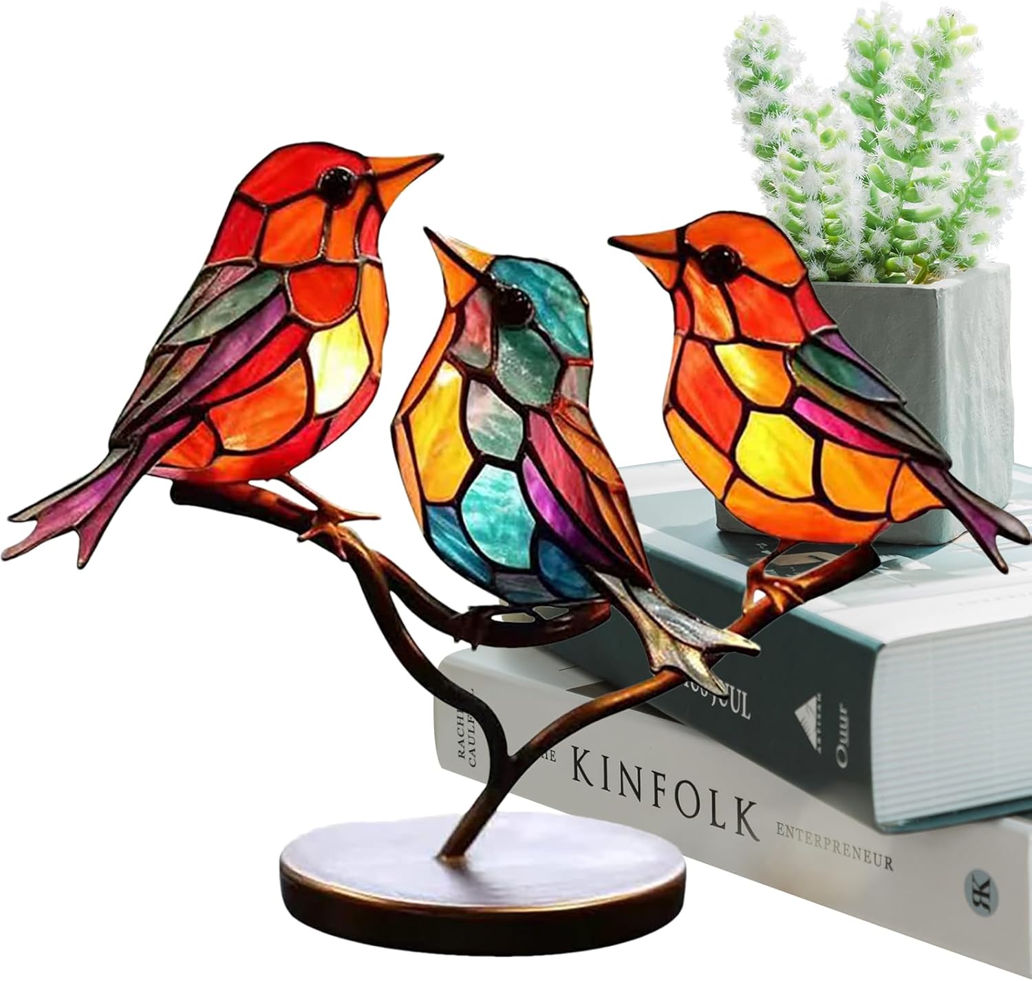 Colorful stained glass bird lamps on a branch with a white background