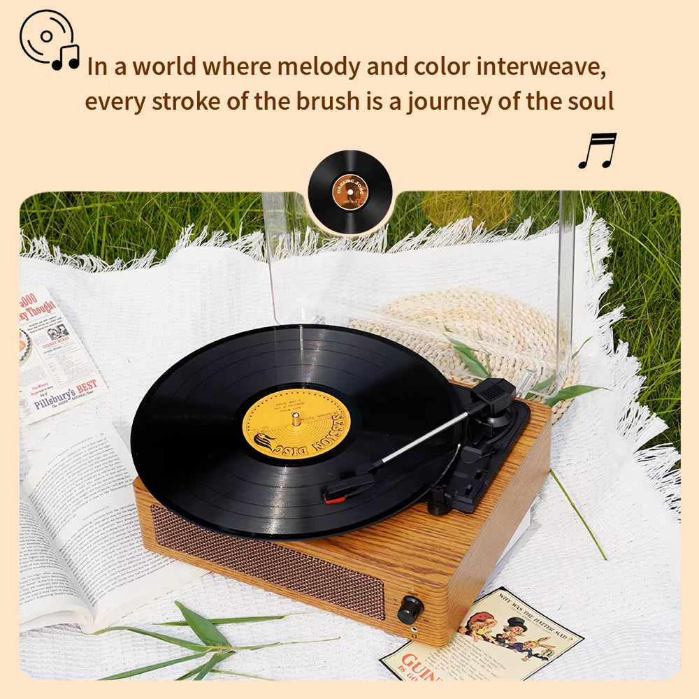 Record player with a vinyl record on a grassy background with text overlay.