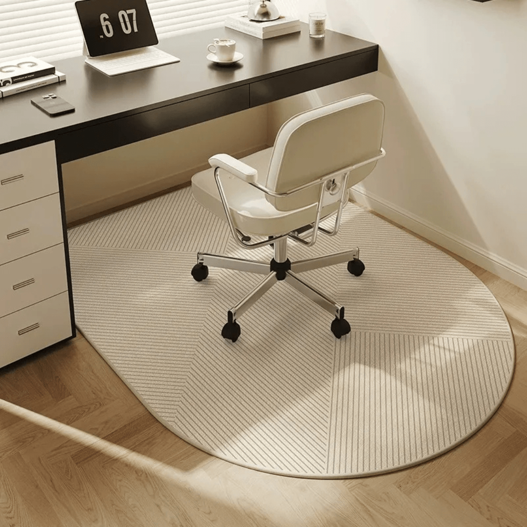 Round office rug with a chair in front of a desk.