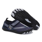 Pair of navy and gray water shoes with black soles on a white background