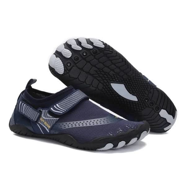 Pair of navy and gray water shoes with black soles on a white background