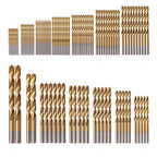 Set of gold and silver drill bits arranged in rows on a white background