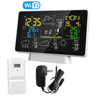 Digital weather station with large display, remote sensor, power adapter, and cable on a white background.