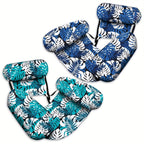 Set of blue and white leaf-patterned seat covers on a white background