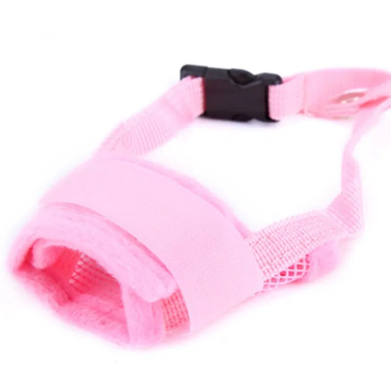 Pink dog muzzle with black buckle on a white background