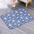 Blue pet mat with dog pattern on a wooden floor