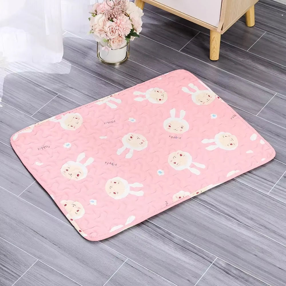 Pink rug with cartoon bunny designs on a gray floor.