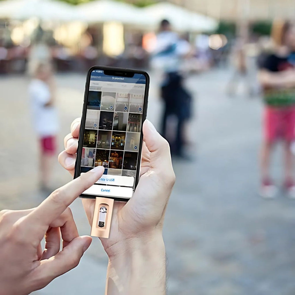 Person holding a smartphone with a social media app open, blurred outdoor background