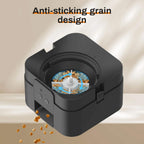 Black grain grinder with anti-sticking design on a beige background