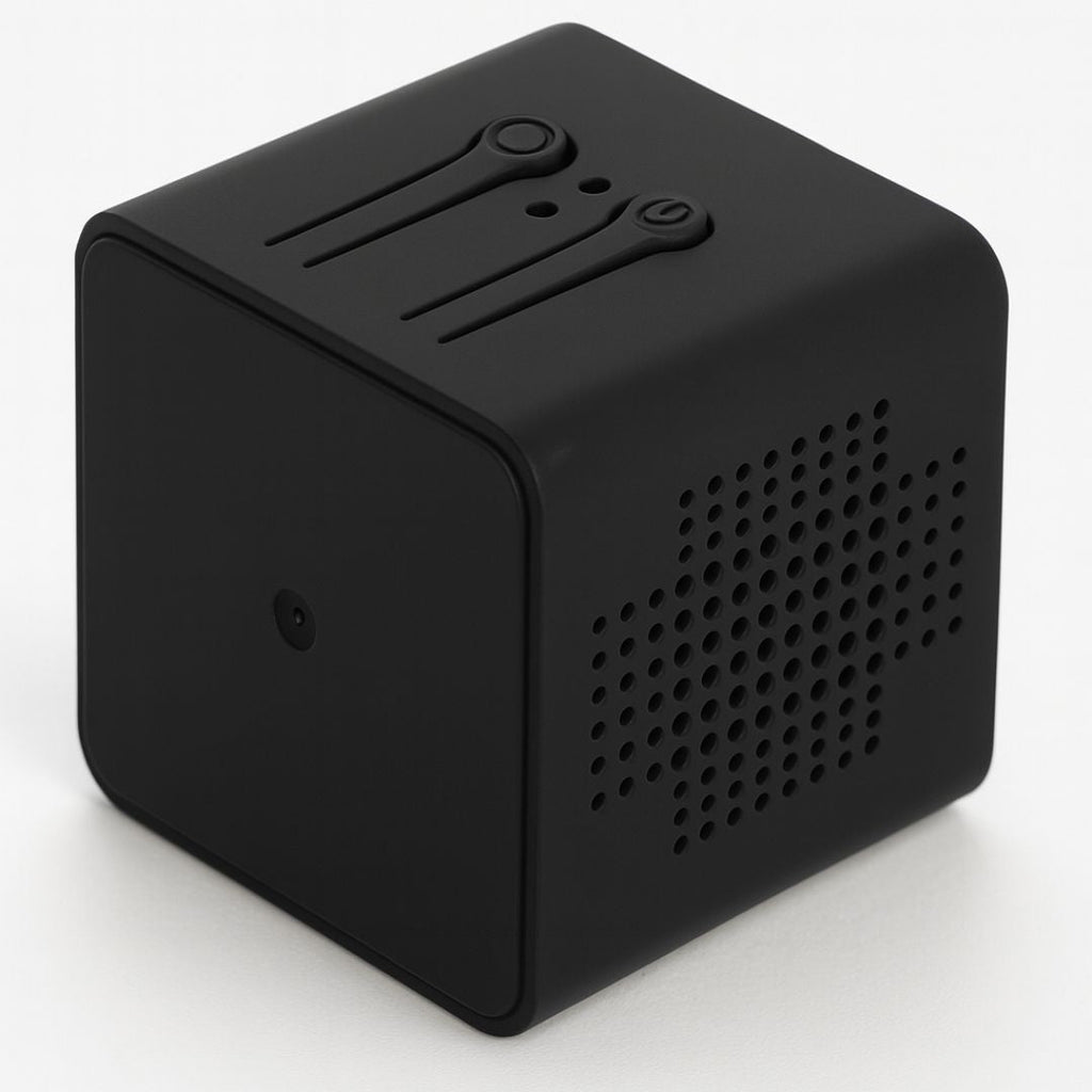 Black cube-shaped device with speaker grille on a white background