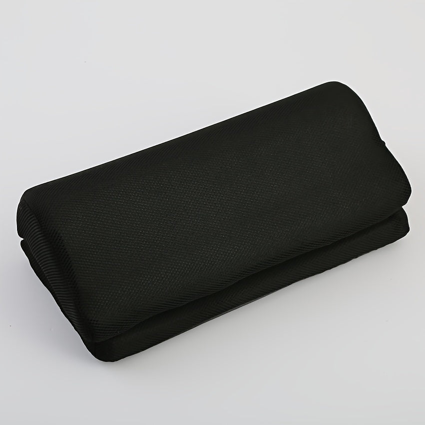 Black fabric roll on a light gray background