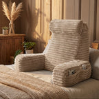 Beige textured bed wedge pillow on a bed with a cozy bedroom setting.