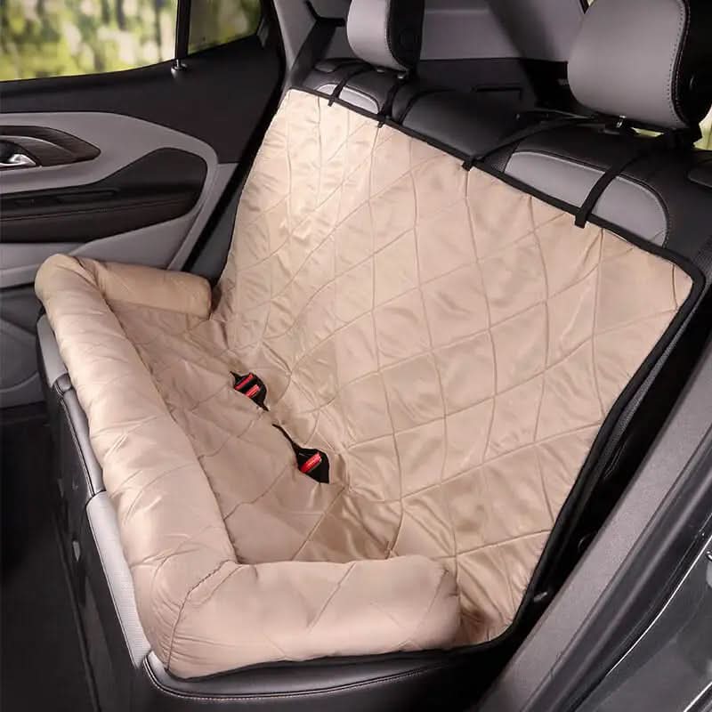 Beige car seat cover on a car seat with visible straps.