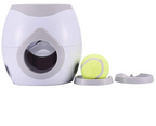 White pet toy with a tennis ball on a white background