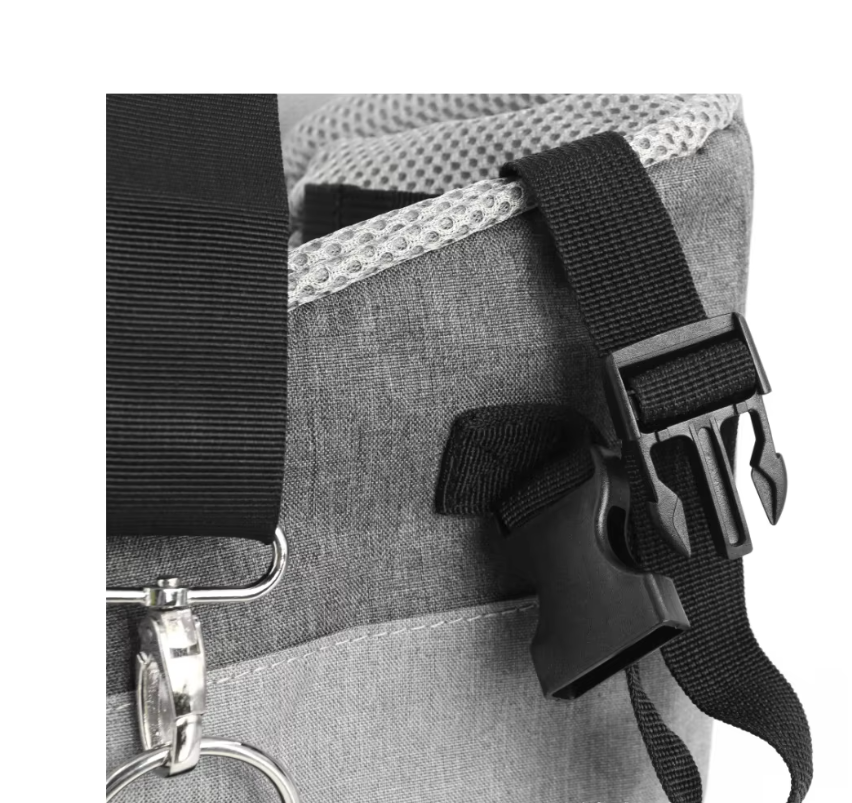 Close-up of a gray bag with black straps and buckles on a white background