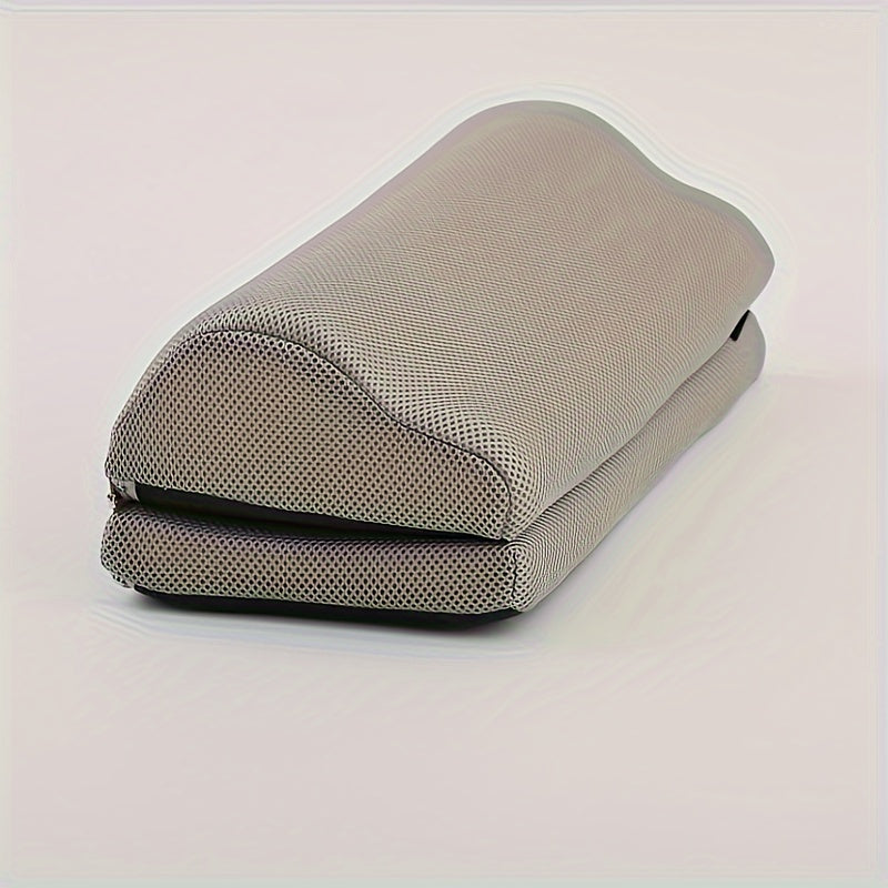 Gray foam roller on a light pink background