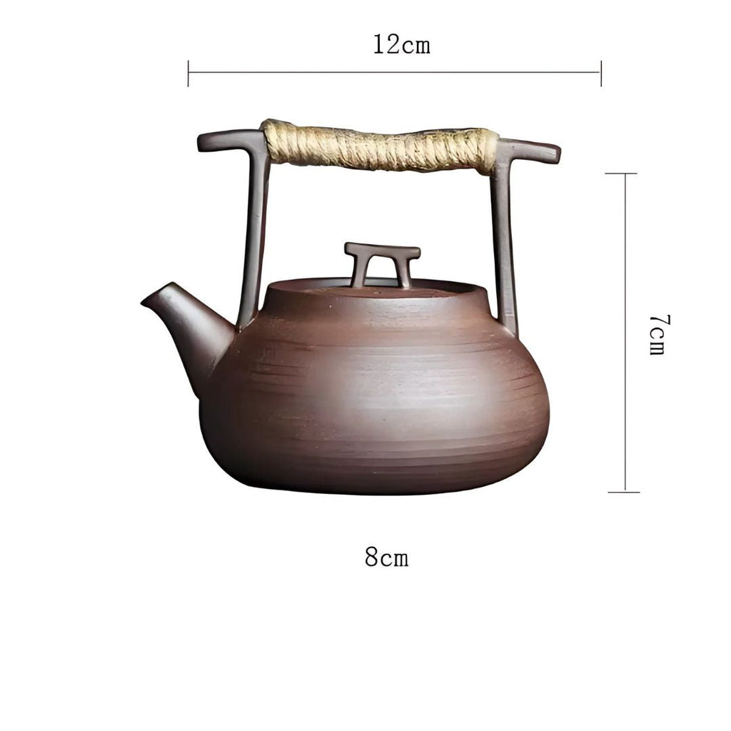Ceramic teapot with measurements on a white background